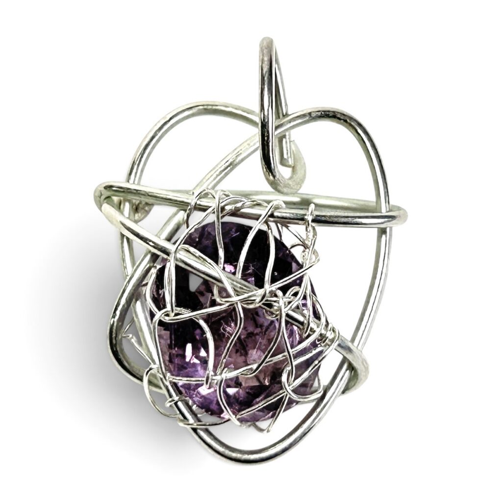 Faceted Oval Amethyst in a heart shaped pendant